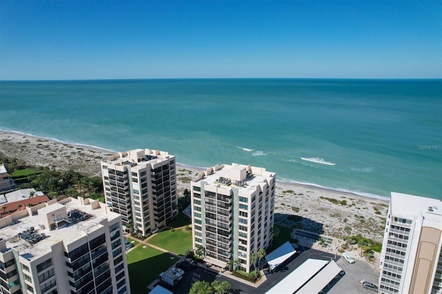 aerial view featuring a view of the beach and a water view