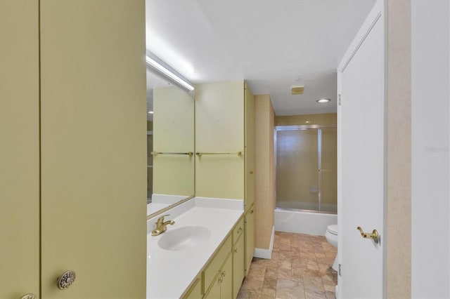 full bathroom featuring vanity, toilet, and enclosed tub / shower combo