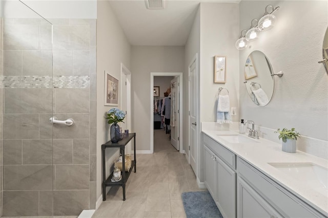 bathroom with tile patterned floors and vanity