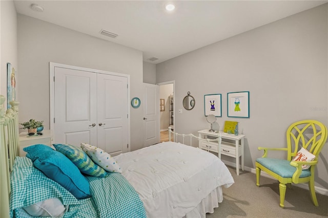 carpeted bedroom featuring a closet