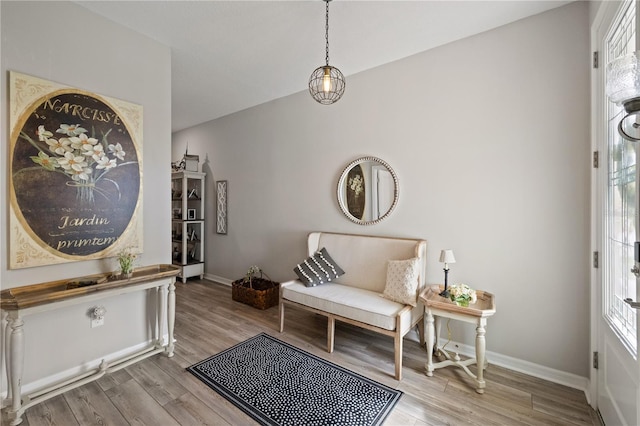 interior space featuring light wood finished floors and baseboards