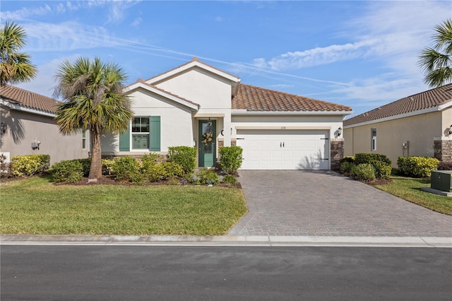 ranch-style home featuring a garage, a front lawn, decorative driveway, and stucco siding