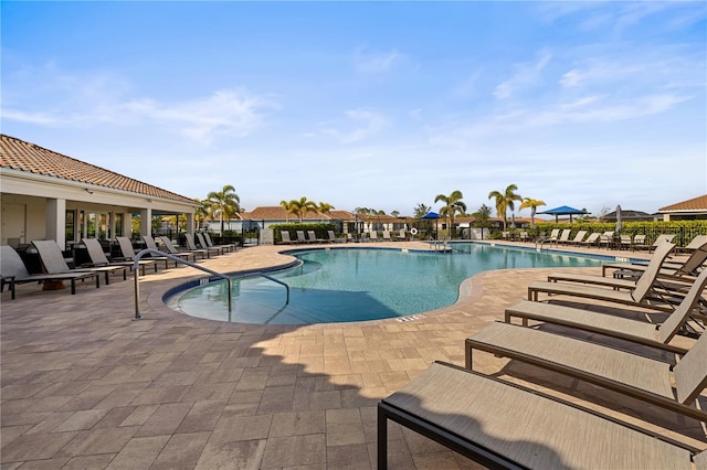 view of swimming pool with a patio