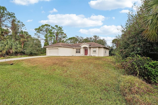 ranch-style home with a garage, stucco siding, concrete driveway, and a front yard