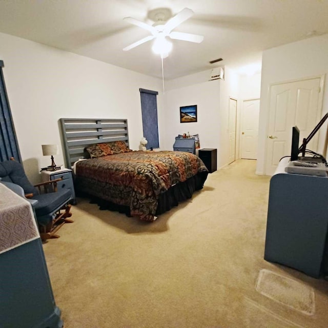 bedroom with light carpet and ceiling fan