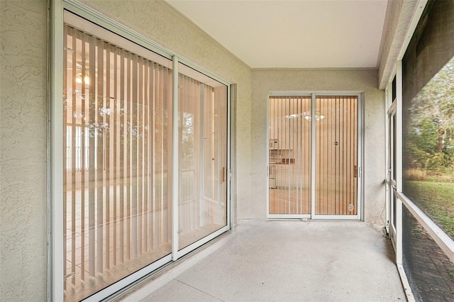 unfurnished sunroom with a wealth of natural light