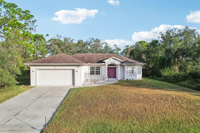 ranch-style home with a garage, driveway, a front lawn, and stucco siding