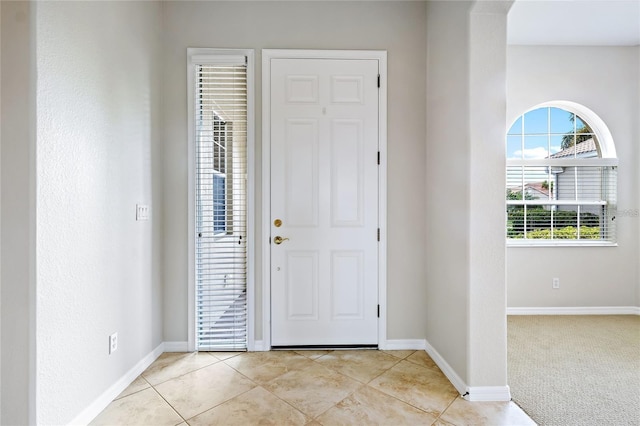 entrance foyer featuring light tile patterned floors