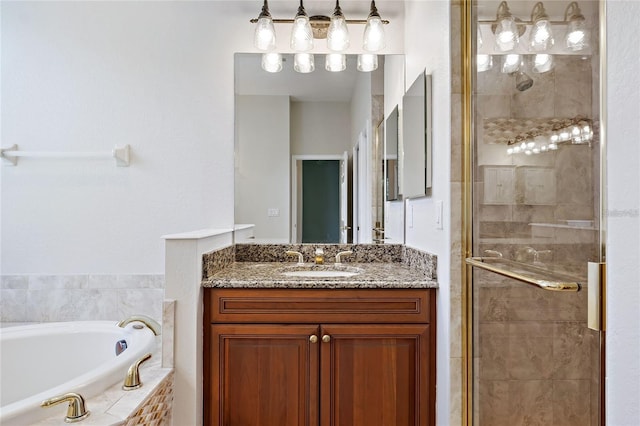 bathroom with vanity and independent shower and bath