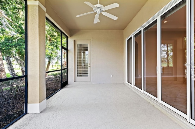 sunroom featuring ceiling fan