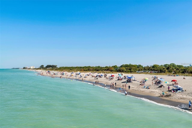 aerial view featuring a water view and a view of the beach