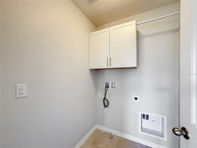 clothes washing area featuring cabinets, washer hookup, electric dryer hookup, tile patterned floors, and a textured ceiling