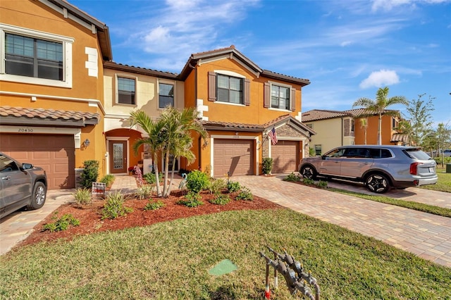 view of front facade with a front yard and a garage