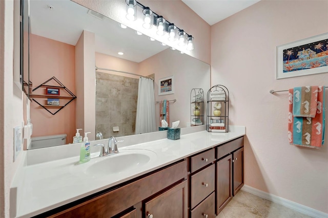 bathroom featuring vanity, toilet, a shower with shower curtain, and tile patterned flooring