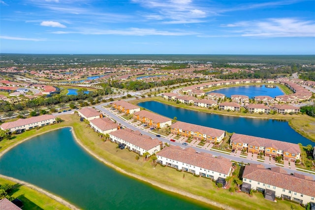 birds eye view of property with a water view