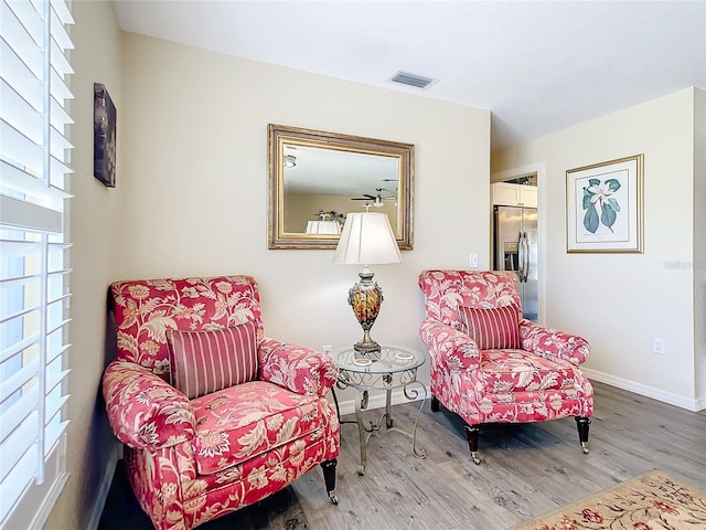 sitting room with hardwood / wood-style floors