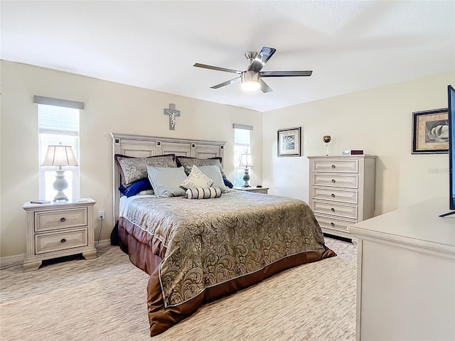 bedroom featuring ceiling fan and light colored carpet