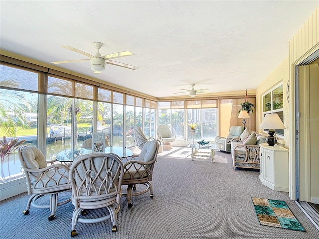 sunroom with ceiling fan