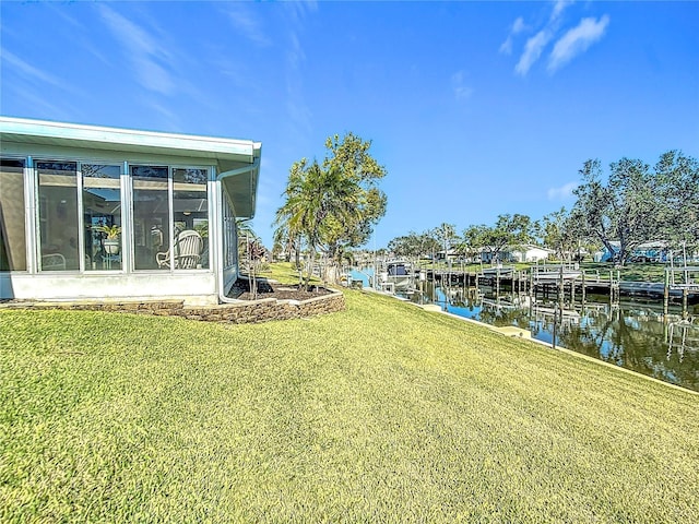 4 Windsor Dr, Englewood, FL 34223 - view of yard with a water view, a sunroom, and a dock