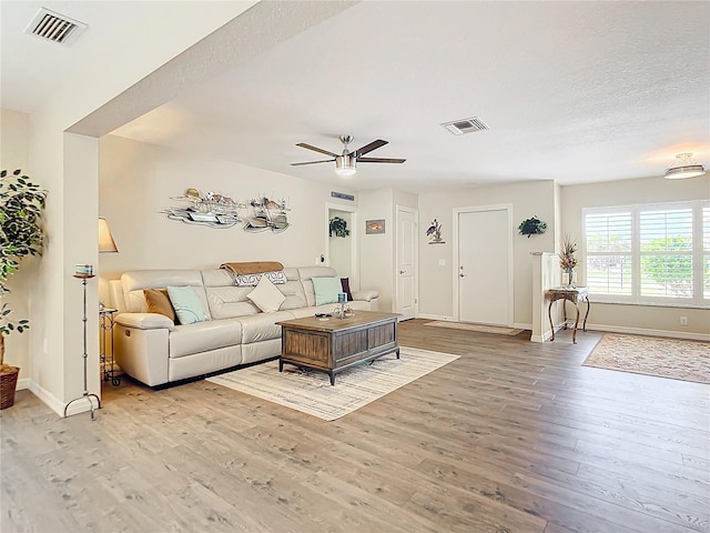 4 Windsor Dr, Englewood, FL 34223 - living area featuring baseboards, visible vents, light wood-type flooring, and a ceiling fan