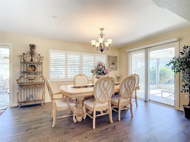 4 Windsor Dr, Englewood, FL 34223 - dining room featuring wood finished floors, a notable chandelier, and plenty of natural light