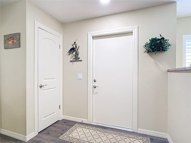 4 Windsor Dr, Englewood, FL 34223 - foyer entrance with baseboards and dark wood finished floors
