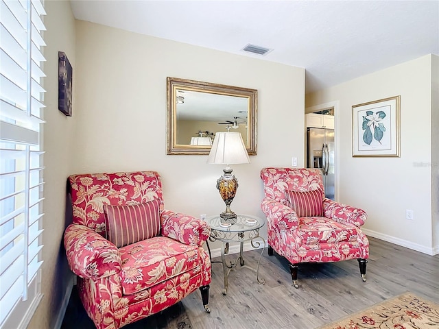 4 Windsor Dr, Englewood, FL 34223 - living area with visible vents, baseboards, and wood finished floors