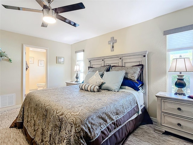 4 Windsor Dr, Englewood, FL 34223 - bedroom with ensuite bath, visible vents, and ceiling fan