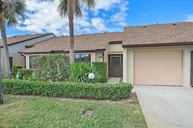 1211 Capri Isles Blvd Unit 58, Venice, FL 34292 - ranch-style home featuring a shingled roof, concrete driveway, an attached garage, and stucco siding