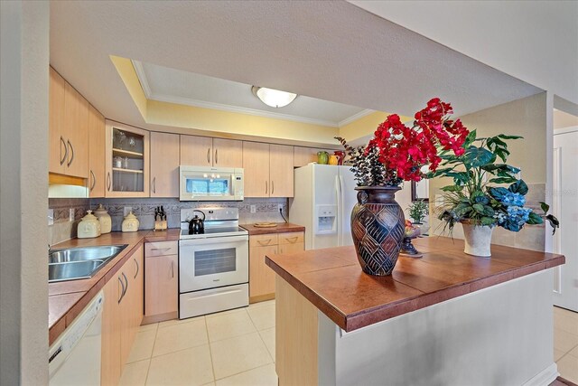 1211 Capri Isles Blvd Unit 58, Venice, FL 34292 - kitchen featuring white appliances, light tile patterned floors, light brown cabinets, decorative backsplash, and glass insert cabinets