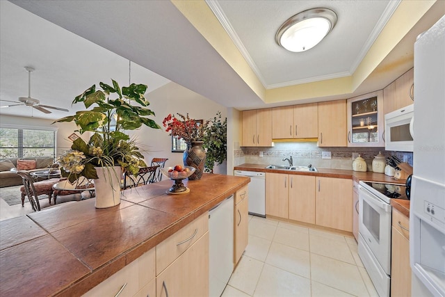 kitchen with light brown cabinetry, tasteful backsplash, white appliances, ceiling fan, and crown molding