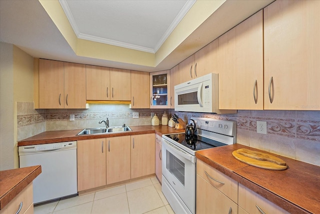 1211 Capri Isles Blvd Unit 58, Venice, FL 34292 - kitchen with white appliances, light brown cabinets, crown molding, decorative backsplash, and glass insert cabinets
