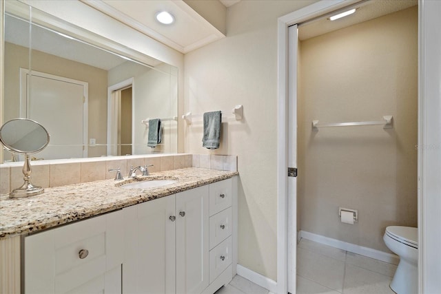 bathroom with tile patterned floors, vanity, and toilet