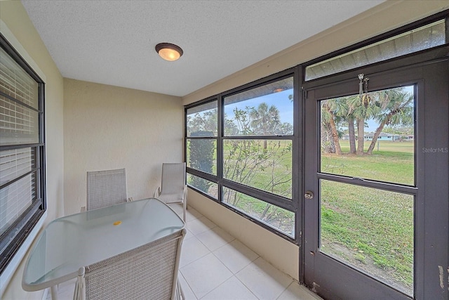 unfurnished sunroom featuring a wealth of natural light