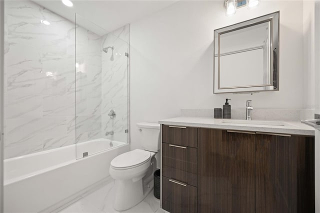 full bathroom featuring vanity, tiled shower / bath combo, and toilet