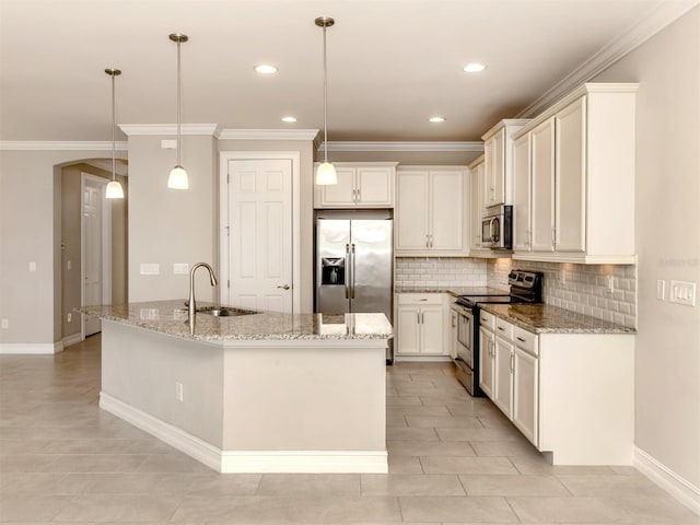 kitchen featuring light stone counters, stainless steel appliances, sink, a center island with sink, and hanging light fixtures