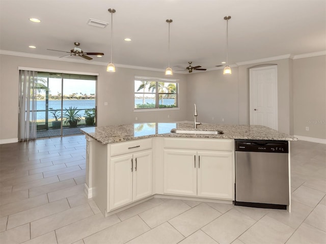 kitchen with stainless steel dishwasher, white cabinets, sink, and a center island with sink