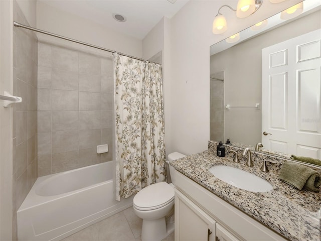 full bathroom featuring shower / bath combo with shower curtain, tile patterned flooring, vanity, and toilet