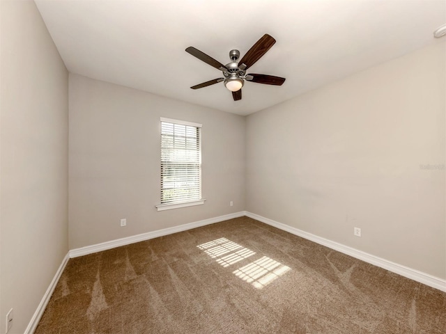 carpeted empty room featuring ceiling fan