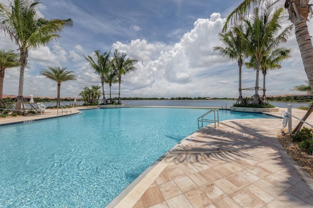 view of pool featuring a water view