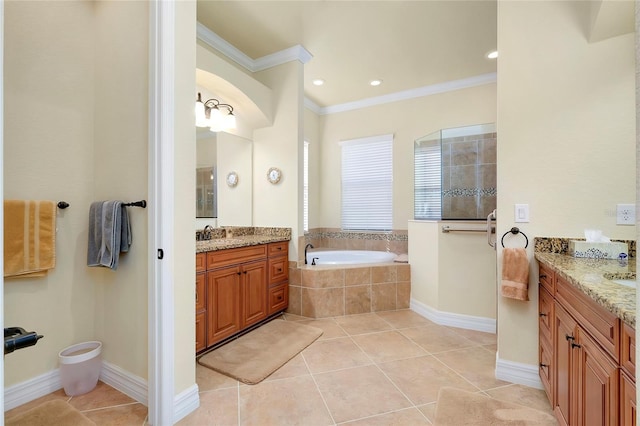 bathroom with tile patterned flooring, vanity, crown molding, and tiled tub