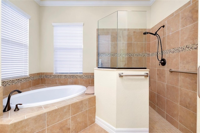 bathroom featuring plus walk in shower, tile patterned floors, and ornamental molding