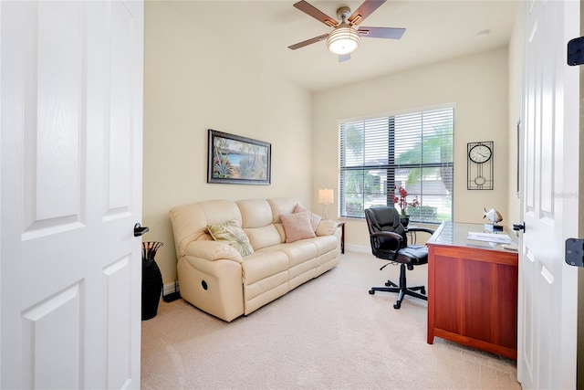 carpeted office with ceiling fan