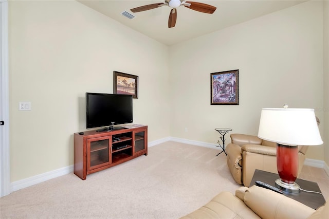 living room with carpet flooring and ceiling fan