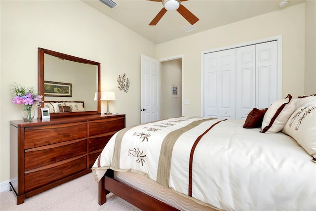 bedroom featuring a closet, ceiling fan, and light colored carpet