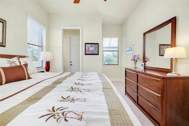 bedroom featuring ceiling fan and light carpet