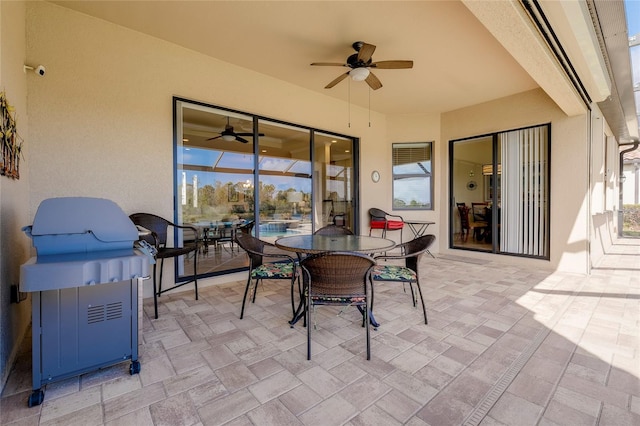 view of patio featuring ceiling fan