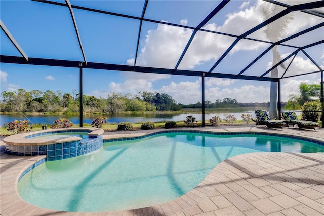 view of swimming pool featuring an in ground hot tub, a patio, a water view, and a lanai