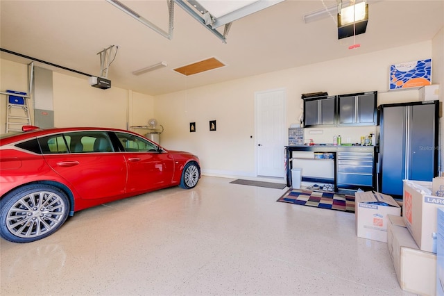 garage with electric panel, stainless steel fridge, and a garage door opener