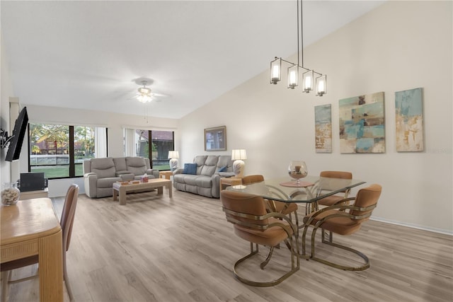 dining area featuring light wood-type flooring, ceiling fan, and lofted ceiling